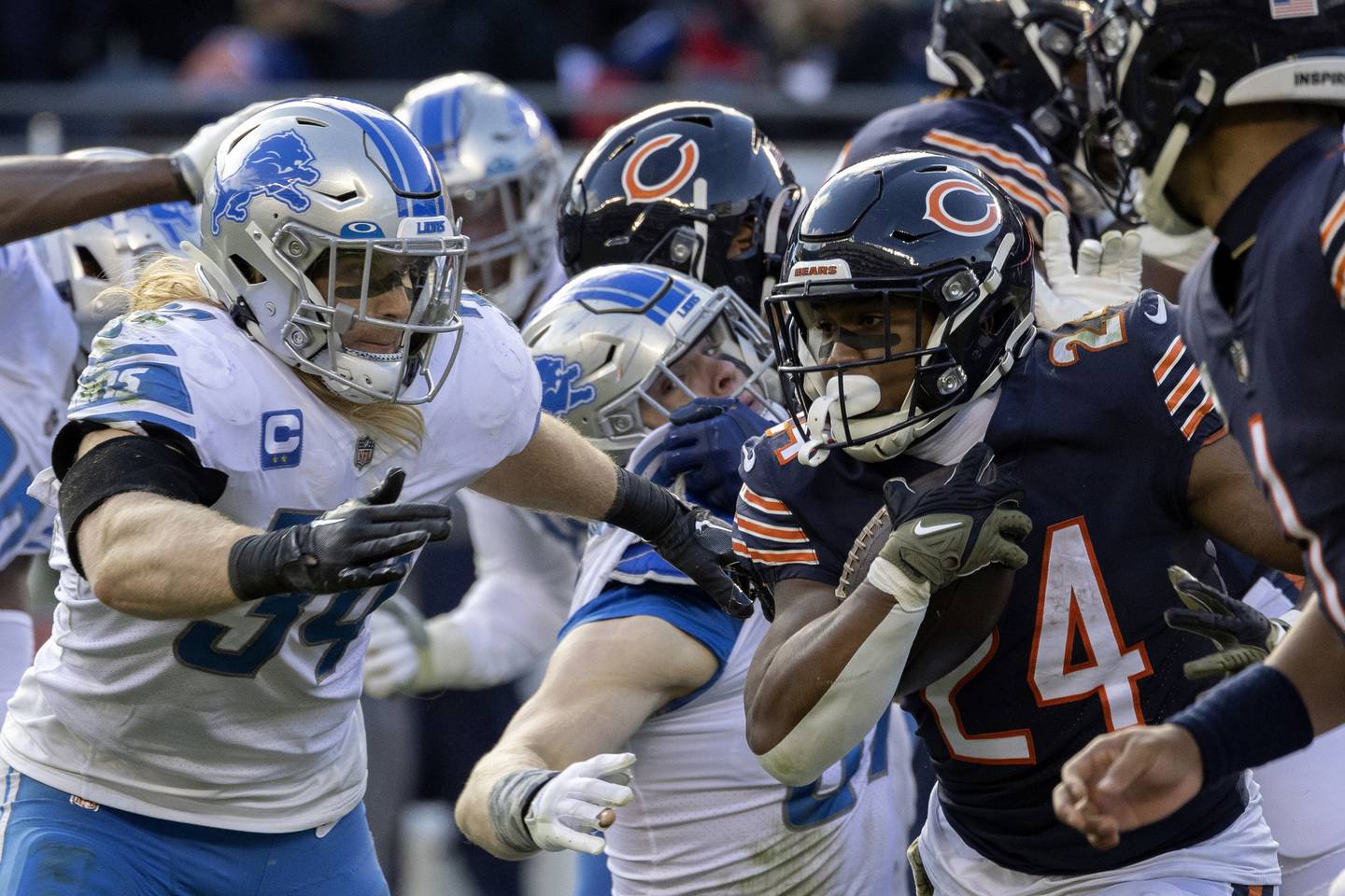Bears running back Khalil Herbert (24) carries the ball during the fourth quarter against the Lions on Sunday at Soldier Field.