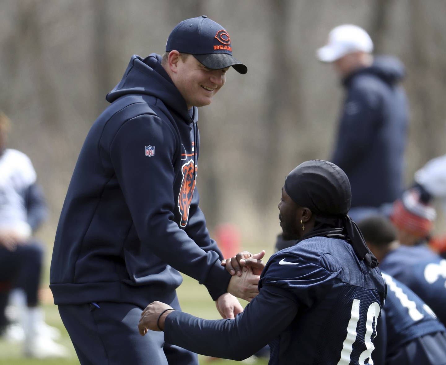 Bears offensive coordinator Luke Getsy greets players during minicamp on April 19, 2022, at Halas Hall. 