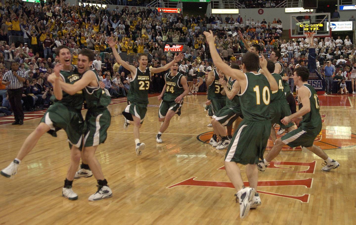 Glenbrook North players celebrate their 53-51 victory over Carbondale in the IHSA Class AA state final on March 19, 2005, in Peoria.