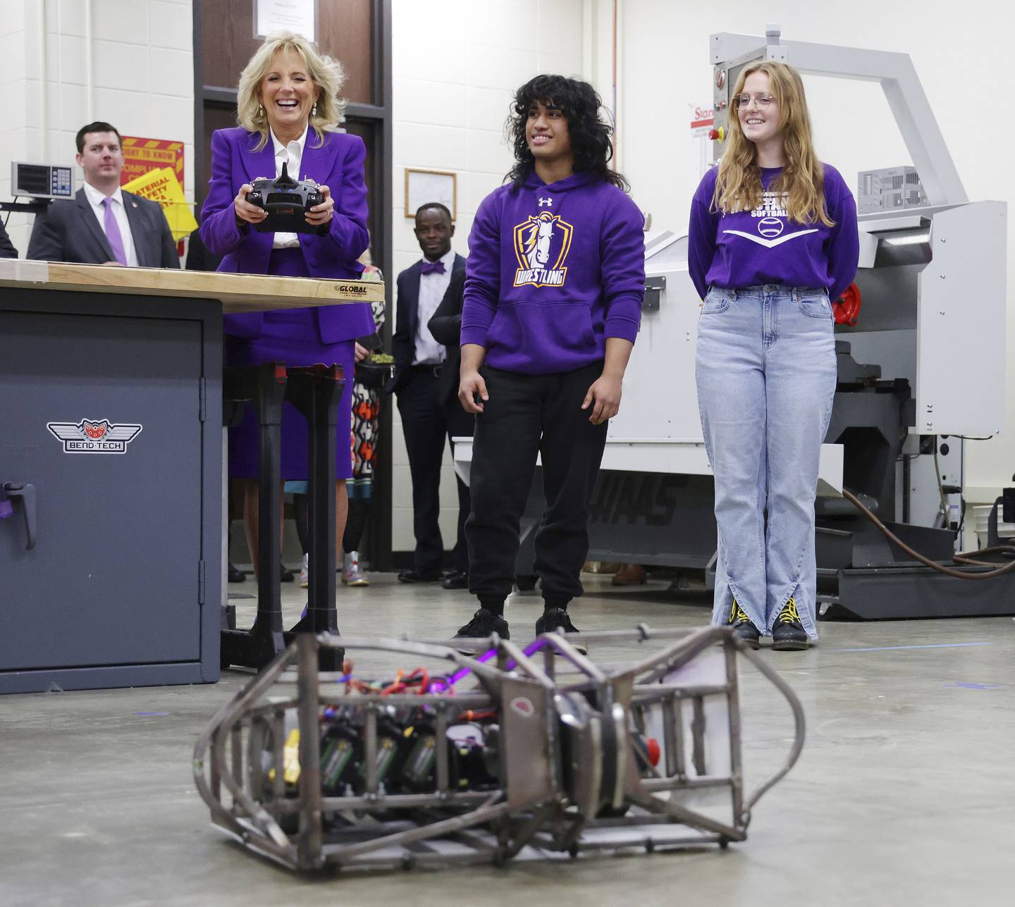 First lady Jill Biden steers a robot while robotics students Ethan Salibio and Kaitlyn De Loncker watch at Rolling Meadows High School on Nov. 14, 2022, in Rolling Meadows. 