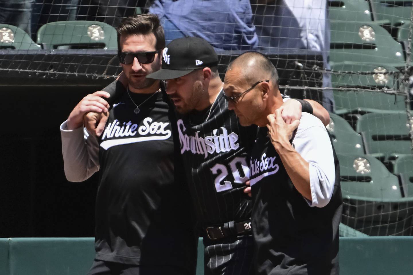 White Sox infielder Danny Mendick is helped off the field after suffering a right knee injury against the Blue Jays on June 22, 2022, at Guaranteed Rate Field. 