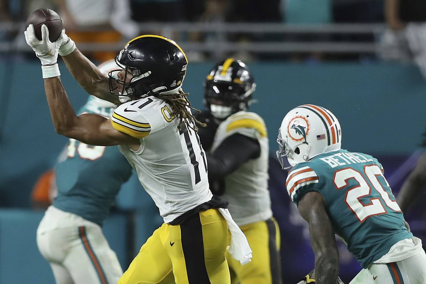 Steelers receiver Chase Claypool catches a pass in front of the Dolphins' Justin Bethel during the fourth quarter on Oct. 23 at Hard Rock Stadium in Miami Gardens, Fla. 