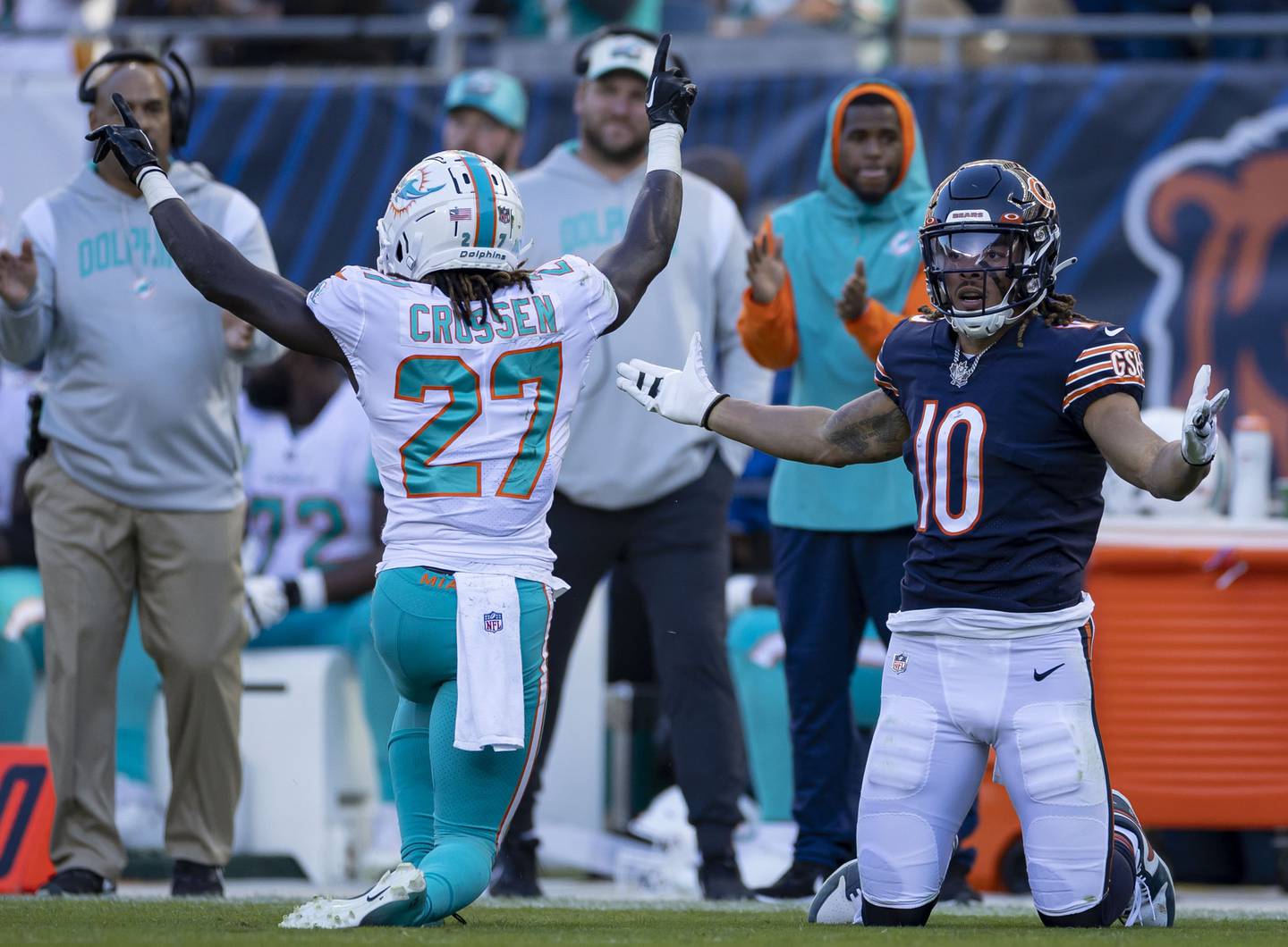 Bears wide receiver Chase Claypool looks for a flag as Dolphins cornerback Keion Crossen celebrates a stop late in the fourth quarter on Nov. 6, 2022, at Soldier Field.