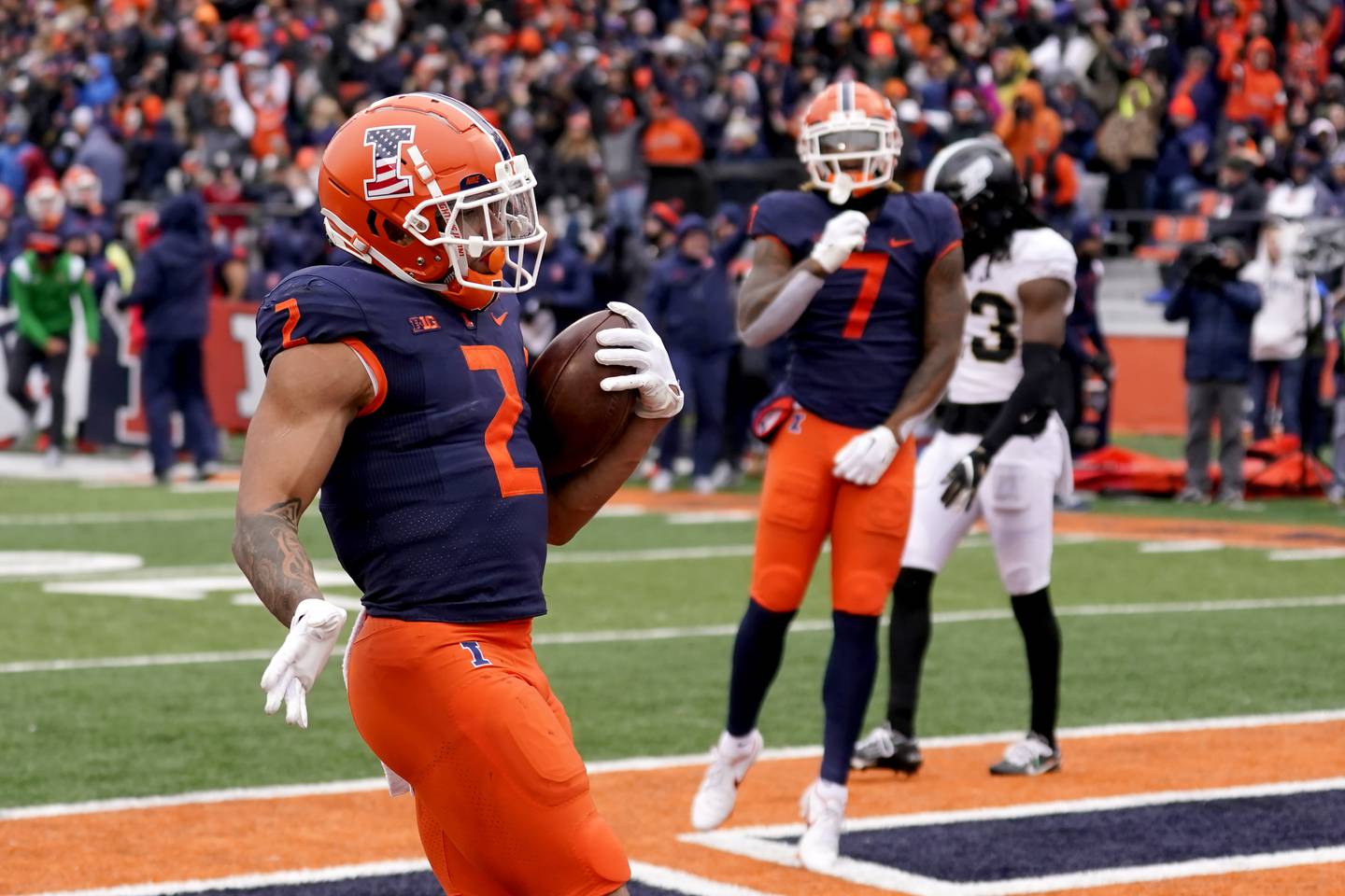 Illinois running back Chase Brown celebrates after scoring during the first half against Purdue, Nov. 12, 2022, at Memorial Stadium in Champaign.