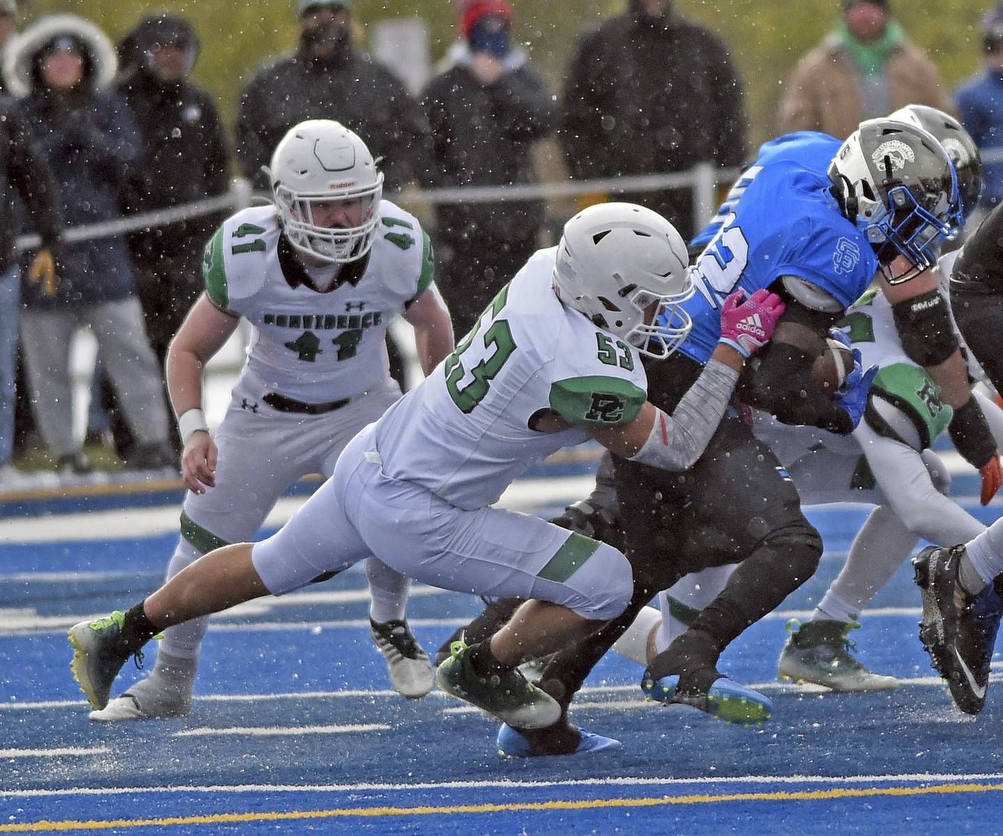 Providence's Byron Olson chases down Wheaton St. Francis' Amari Head for a tackle at the line of scrimmage during a Class 4A state semifinal game in Wheaton on Saturday, Nov. 19, 2022.