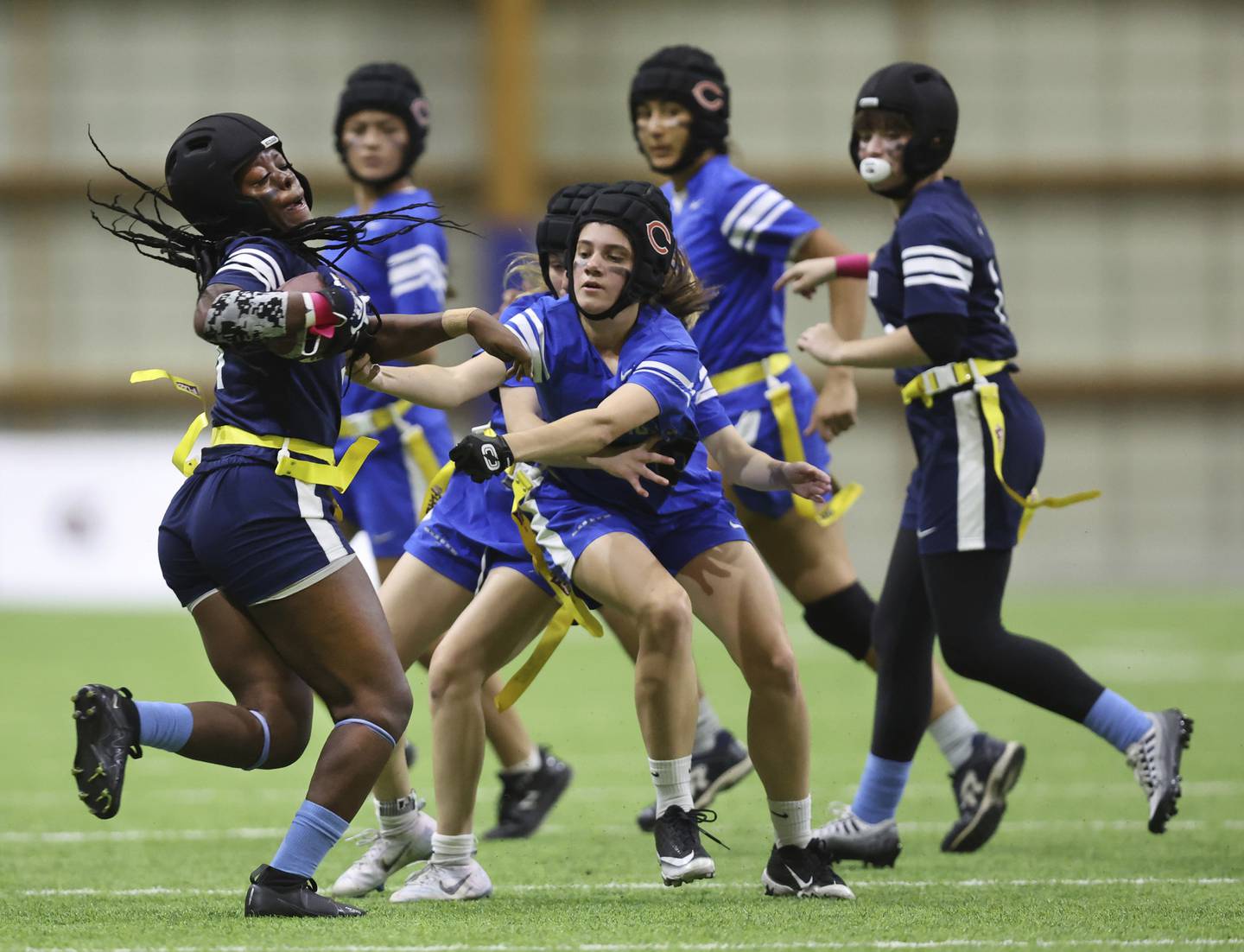 Rockford Guilford High School’s Mya Page (left) tries to elude the Taft High School defense during a semifinal game on Oct. 29, 2022. 
