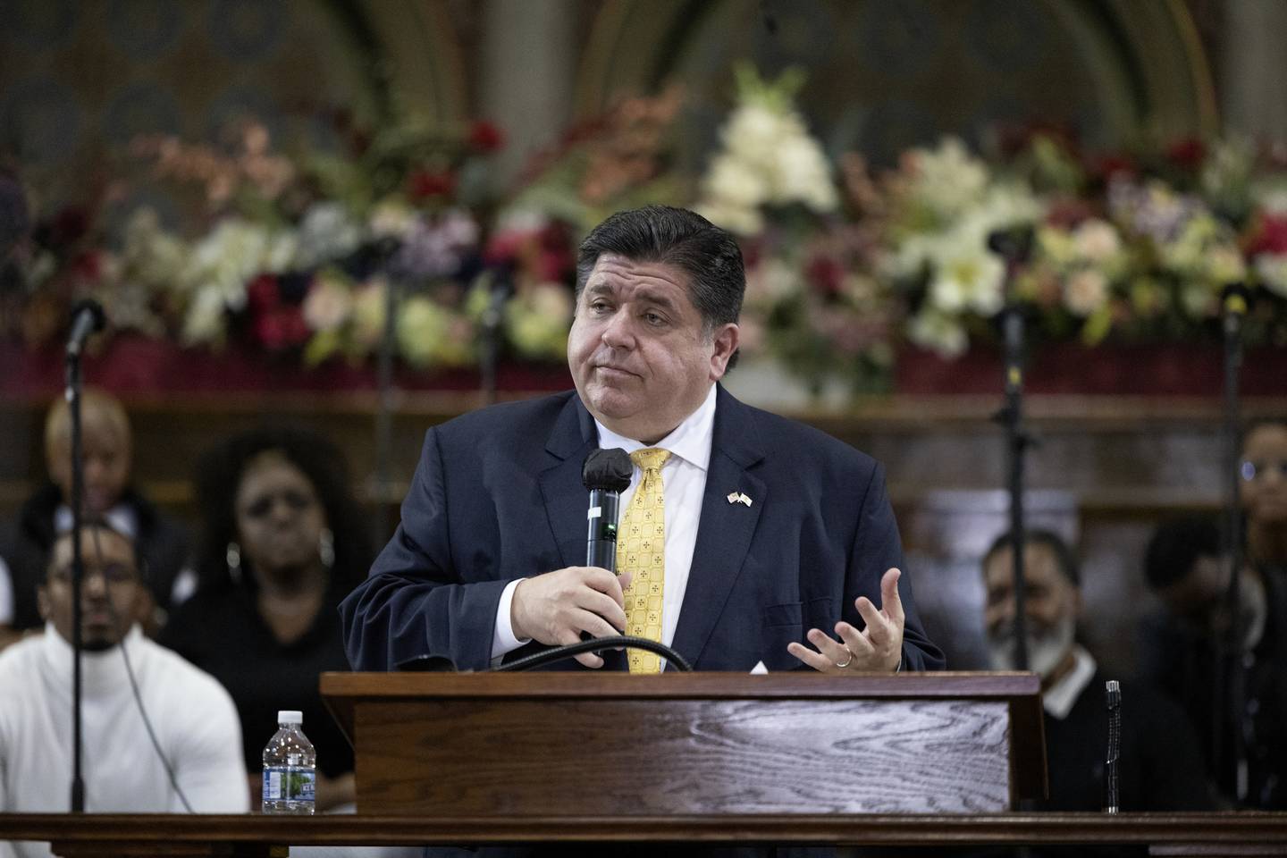 Gov J.B. Pritzker joins Dr. Marshall Elijah Hatch and his congregation during a service on the final weekend before Election Day on Nov. 6, 2022, at New Mount Pilgrim Missionary Baptist Church in East Garfield Park in Chicago.