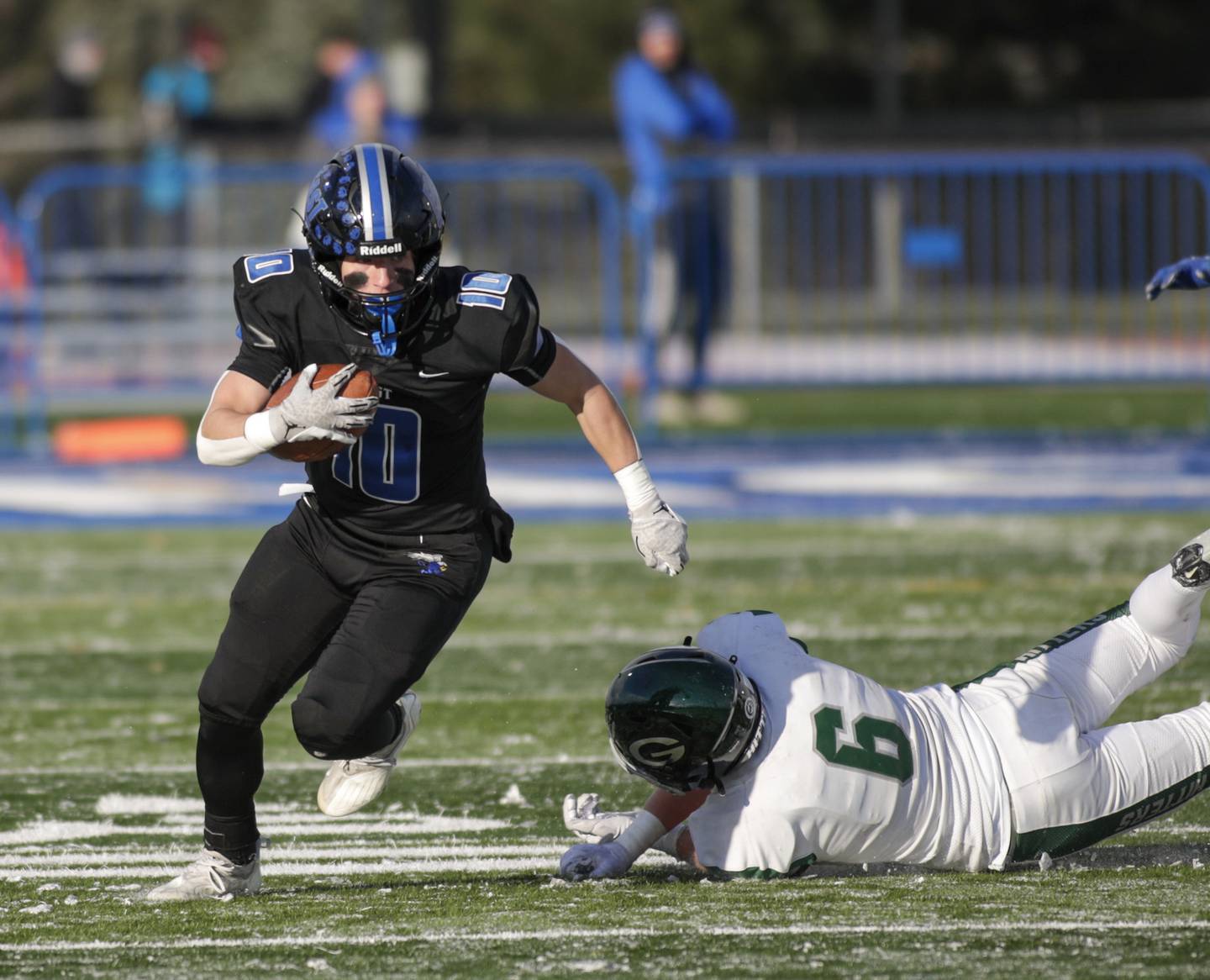 Lincoln-Way East’s Cade Serauskis (10) gets past Glenbard West’s Ben Starmann (6) during a Class 8A state semifinal game in Frankfort on Saturday, Nov. 19, 2022.