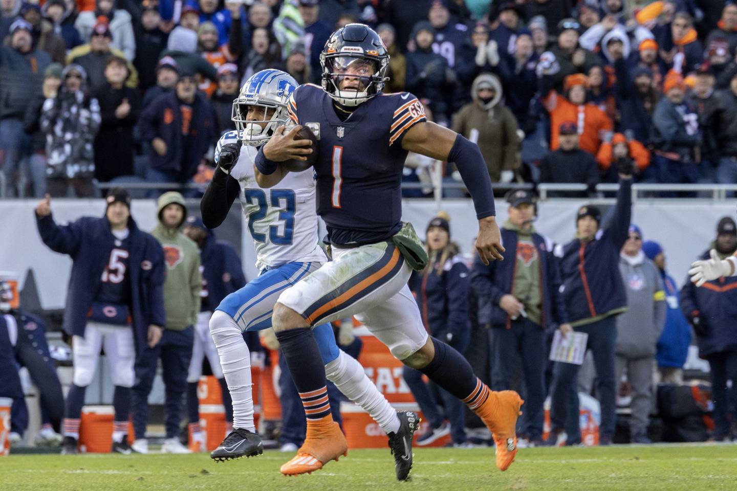 Bears quarterback Justin Fields dashes for a 67-yard touchdown in the fourth quarter against the Lions on Sunday at Soldier Field. 