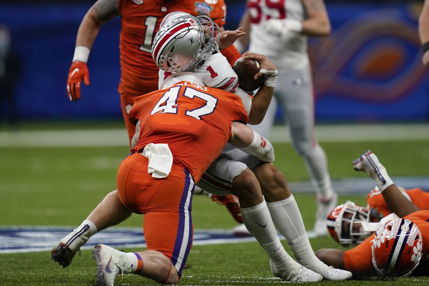 Ohio State quarterback Justin Fields gets hit by Clemson linebacker James Skalski during the first half of the Sugar Bowl on Jan. 1, 2021, in New Orleans. 