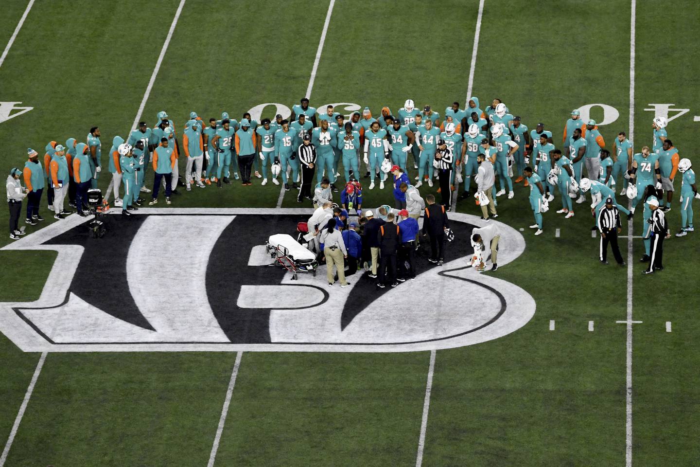 Teammates gather around Dolphins quarterback Tua Tagovailoa after he suffered an injury during the first half of a game against the Bengals on Sept. 29 in Cincinnati. 