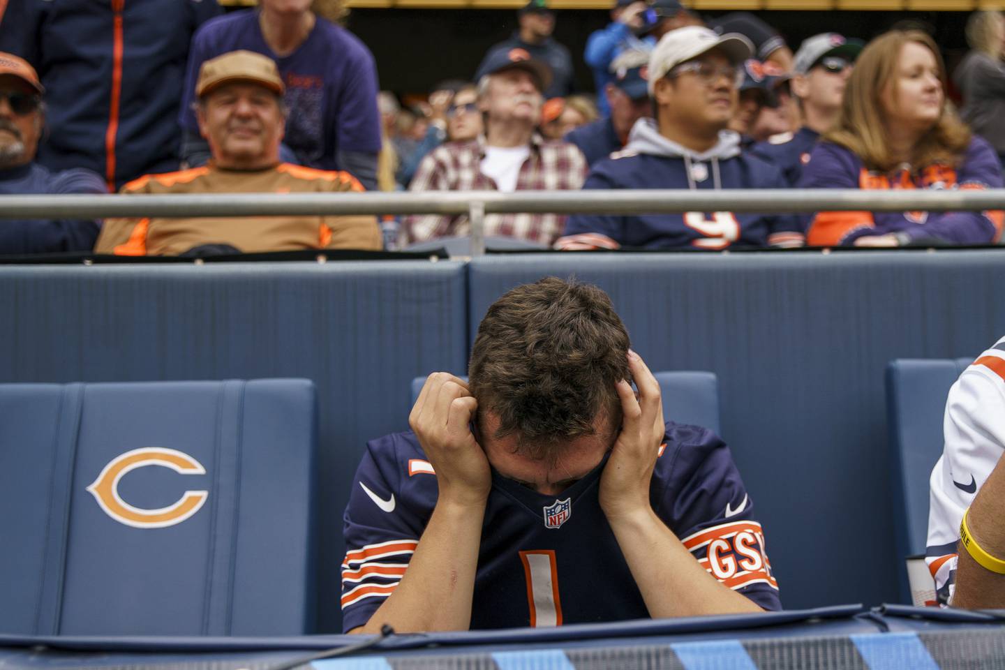 A Chicago Bears fan reacts after quarterback Justin Fields was interception by the Houston Texans during the fourth quarter, Sept. 25, 2022, at Soldier Field.