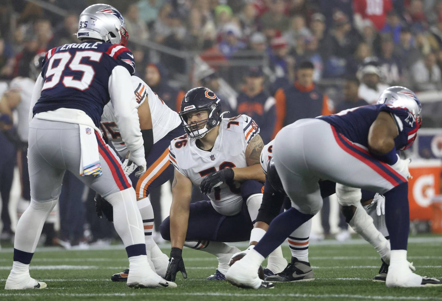 Bears offensive lineman Teven Jenkins (76) gets low for a snap in the first quarter against the Patriots on Oct. 24 at Gillette Stadium in Foxborough, Mass. 