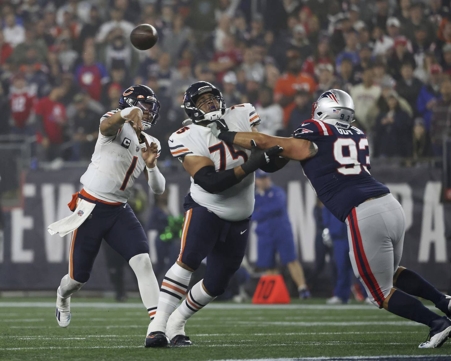 Bears offensive tackle Larry Borom (75) keeps Patriots defensive end Lawrence Guy from reaching quarterback Justin Fields in the second quarter on Oct. 24 at Gillette Stadium in Foxborough, Mass.