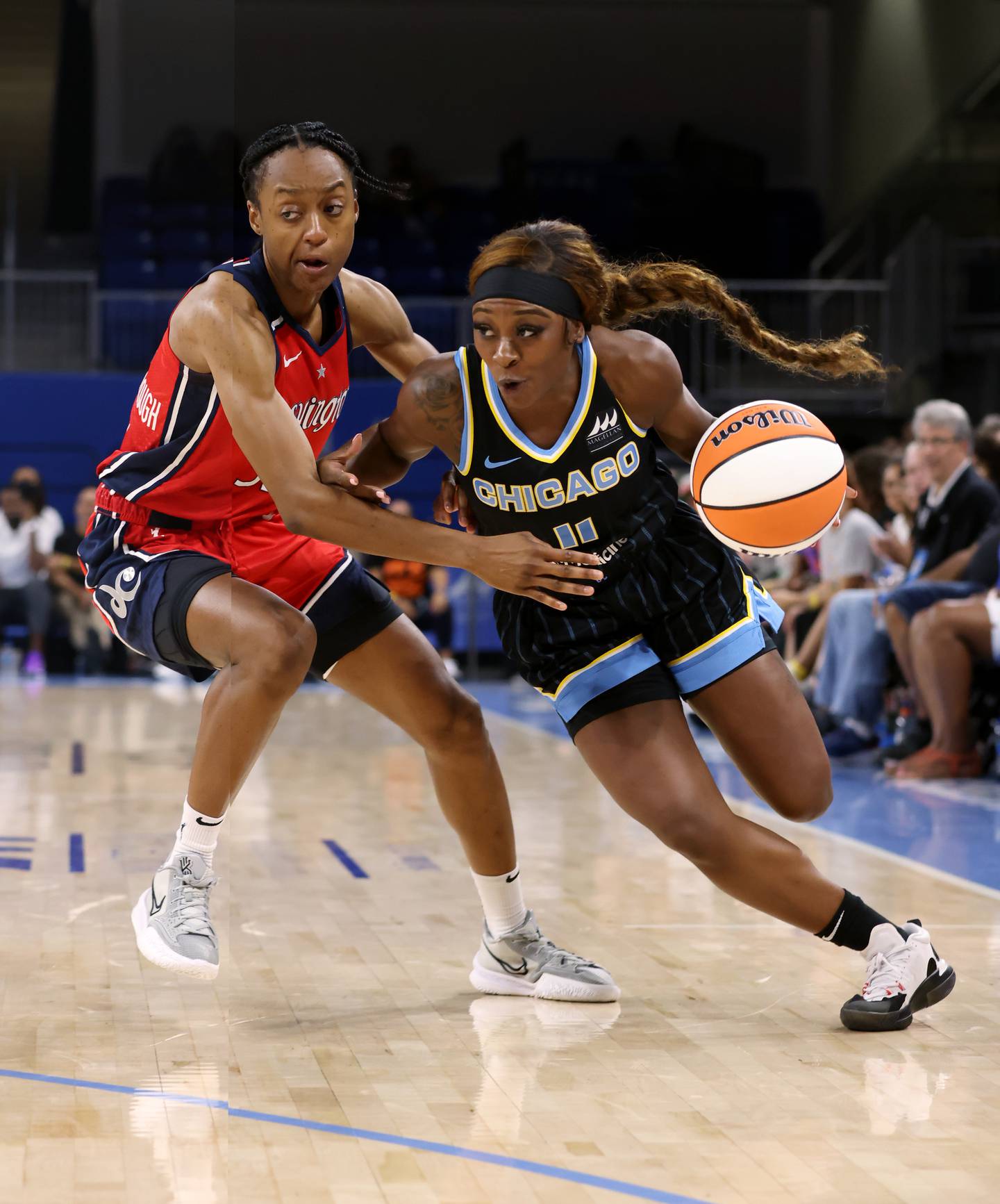 Sky guard Dana Evans drives toward the basket as Mystics guard Shatori Walker-Kimbrough defends in the fourth quarter on Aug. 5, 2022, at Wintrust Arena.