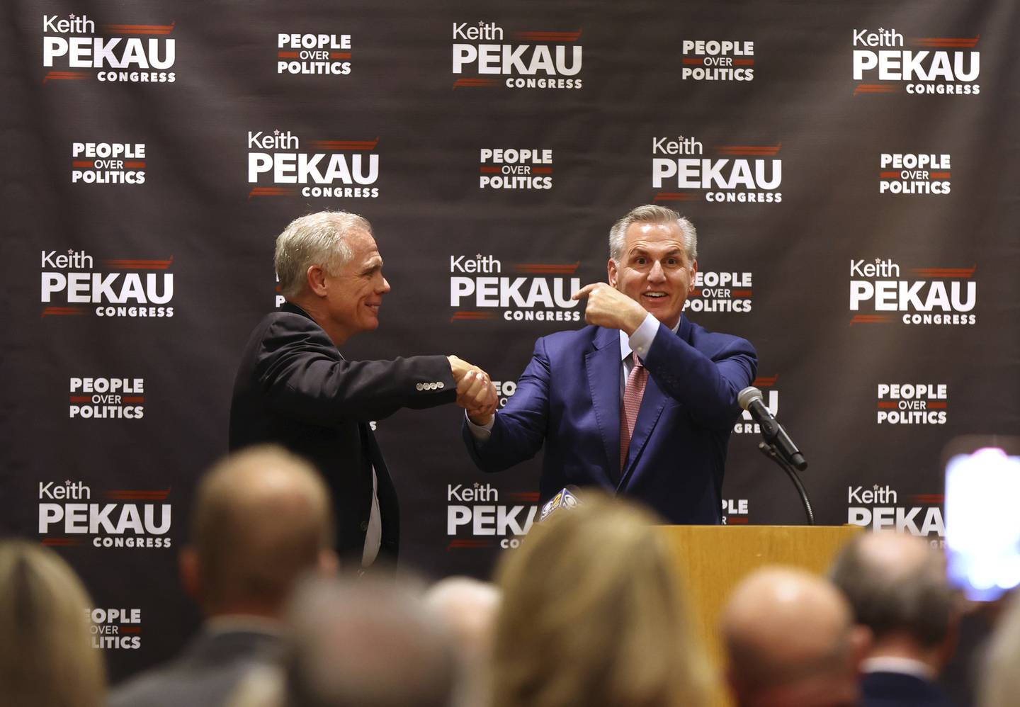 House Minority Leader Kevin McCarthy, right, welcomes to the stage Orland Park Mayor Keith Pekau, left, who is running as a Republican in Illinois’ 6th Congressional District race, during a campaign and fundraising event for Pekau in Oak Brook on Nov. 4, 2022.    