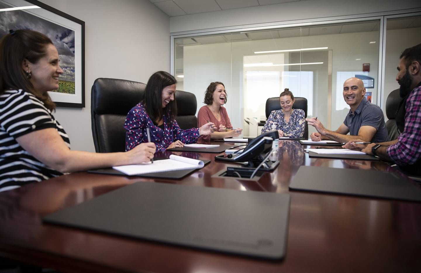 Program manager Susan Brown, of Chicago, from left, program manager Caroline Madden, of Elmhurst, training coordinator Lauren Kyriazes, of Schaumburg, assistant vice president, human resources Ally Watkins, of South Elgin, vice president of information technology Jean-Paul Lupori, of Elk Grove Village and finance manager Syed Bukhara, of Aurora, during a meeting at Captive Resources, Sept. 19, 2022, in Itasca.