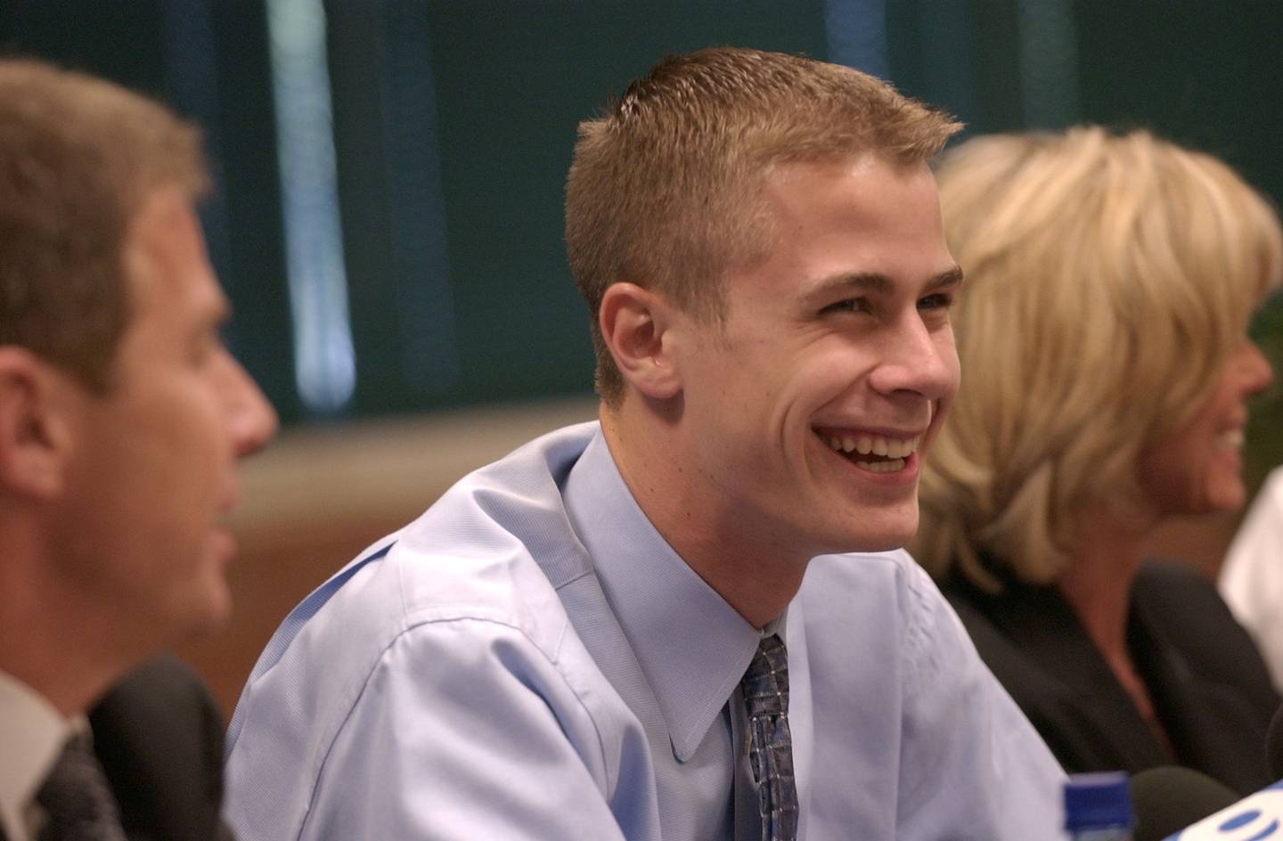 Glenbrook North junior Jon Scheyer announces his commitment to Duke at a news conference at the high school on May 17, 2005, in Northbrook. Scheyer's mother, Laury, is at right and his father, Jim, at left.