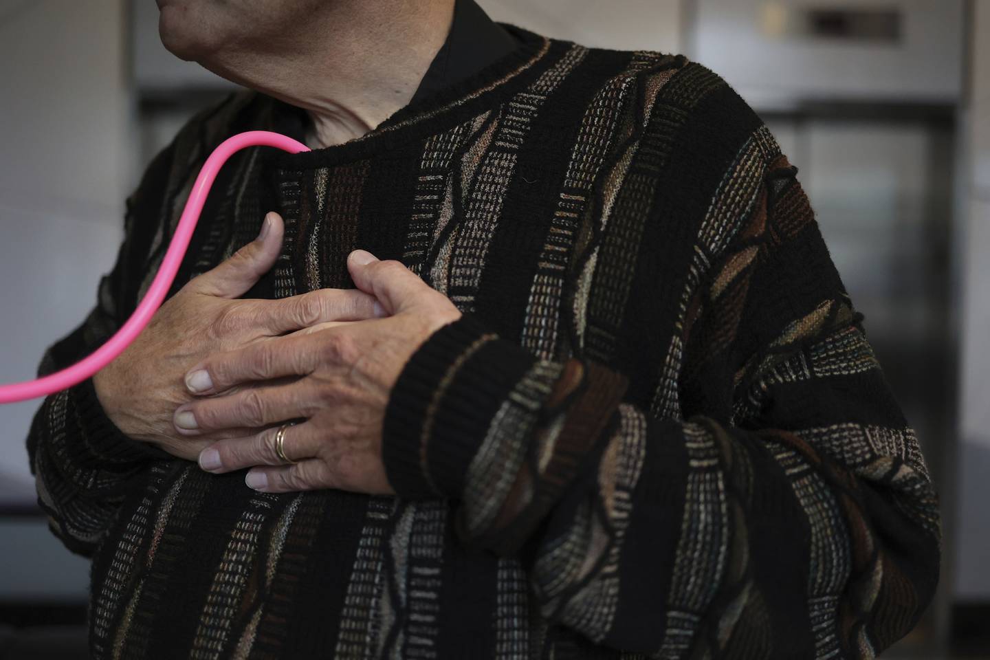 Amber Morgan listens to her daughters heart beat in Tom Johnson as he puts his hands over his heart on Nov. 19, 2022.