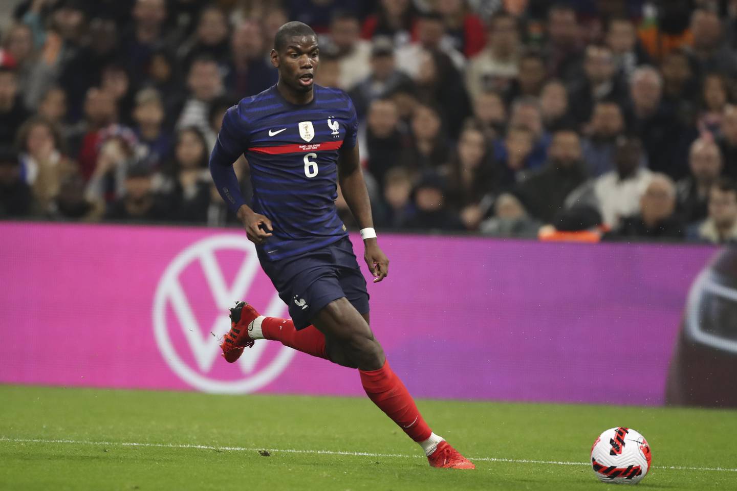 France's Paul Pogba runs with the ball during an international friendly against Cote d'Ivoire at the Velodrome stadium on March 25, 2022.