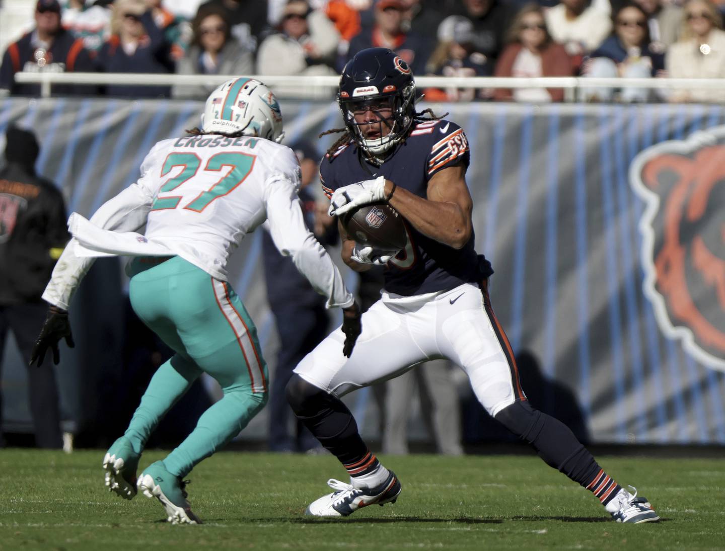 After catching a pass, Bears wide receiver Chase Claypool fakes out Dolphins cornerback Keion Crossen and runs for a first down on Nov. 6 at Soldier Field. 