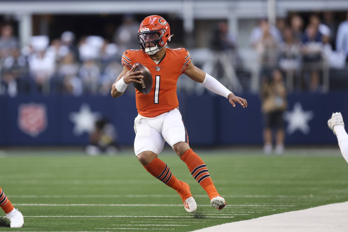 Chicago Bears quarterback Justin Fields runs the ball during the first quarter against the Dallas Cowboys, Oct. 30, 2022, at AT&T Stadium in Arlington, Texas.