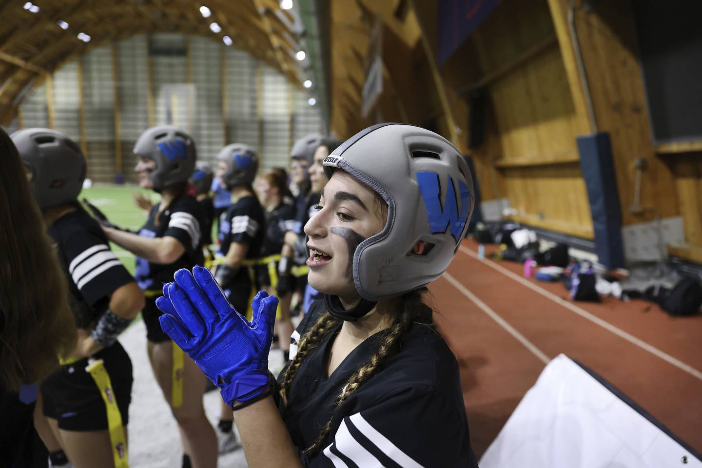 Willowbrook High School player Meri Sutton cheers on the sideline during her team's semifinal game.