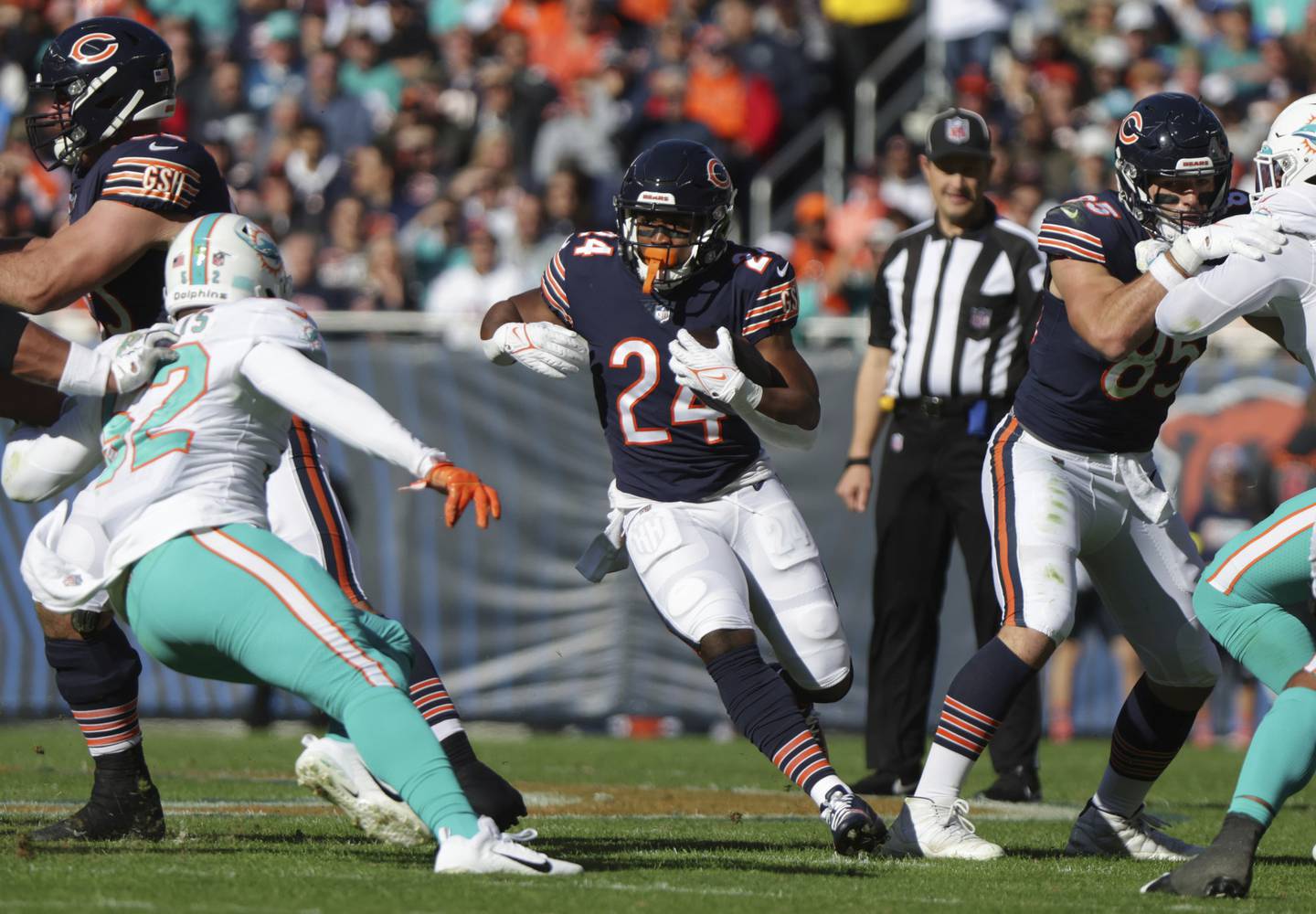 Bears running back Khalil Herbert (24) hits a hole against the Dolphins on Nov. 6, 2022, at Soldier Field.