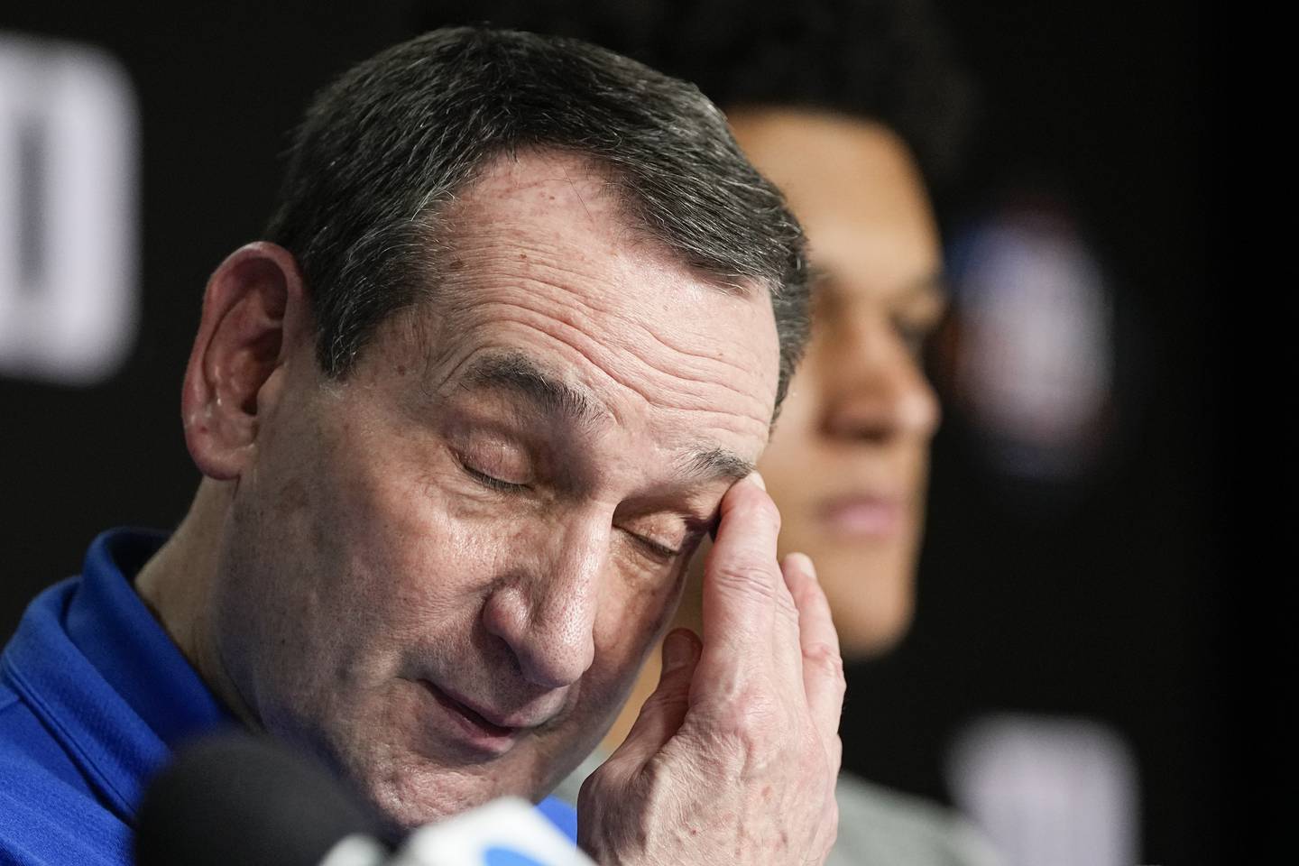 Duke coach Mike Krzyzewski wipes his face during a news conference after a loss to North Carolina in the Final Four on April 2, 2022, in New Orleans.