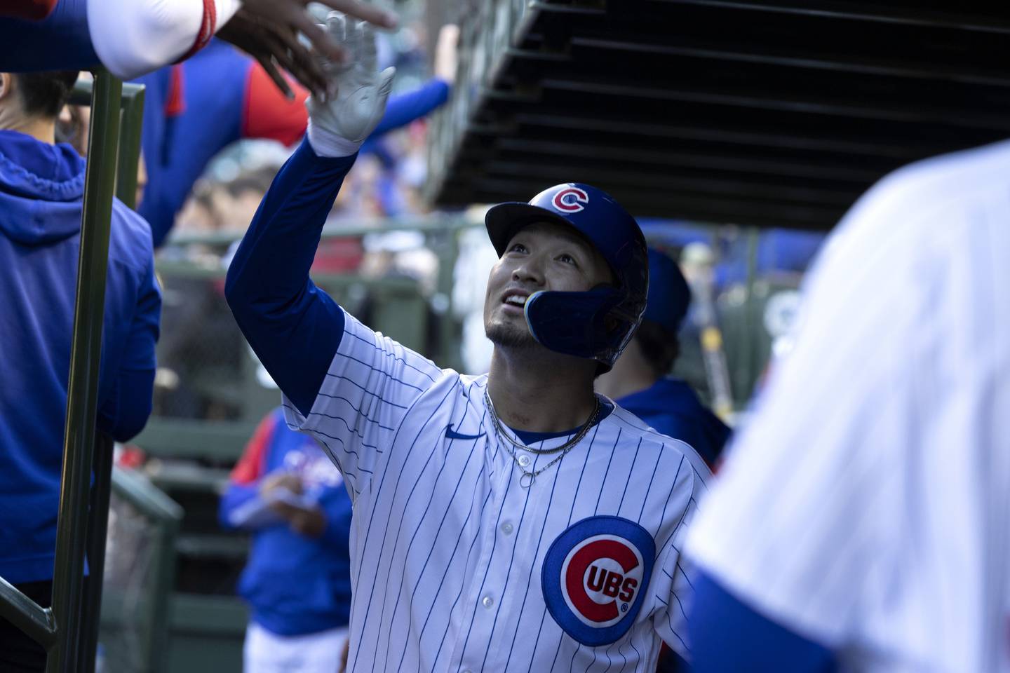 Chicago Cubs right fielder Seiya Suzuki celebrates in the dugout after scoring during the fifth inning against the Philadelphia Phillies, Sept. 29, 2022, at Wrigley Field.