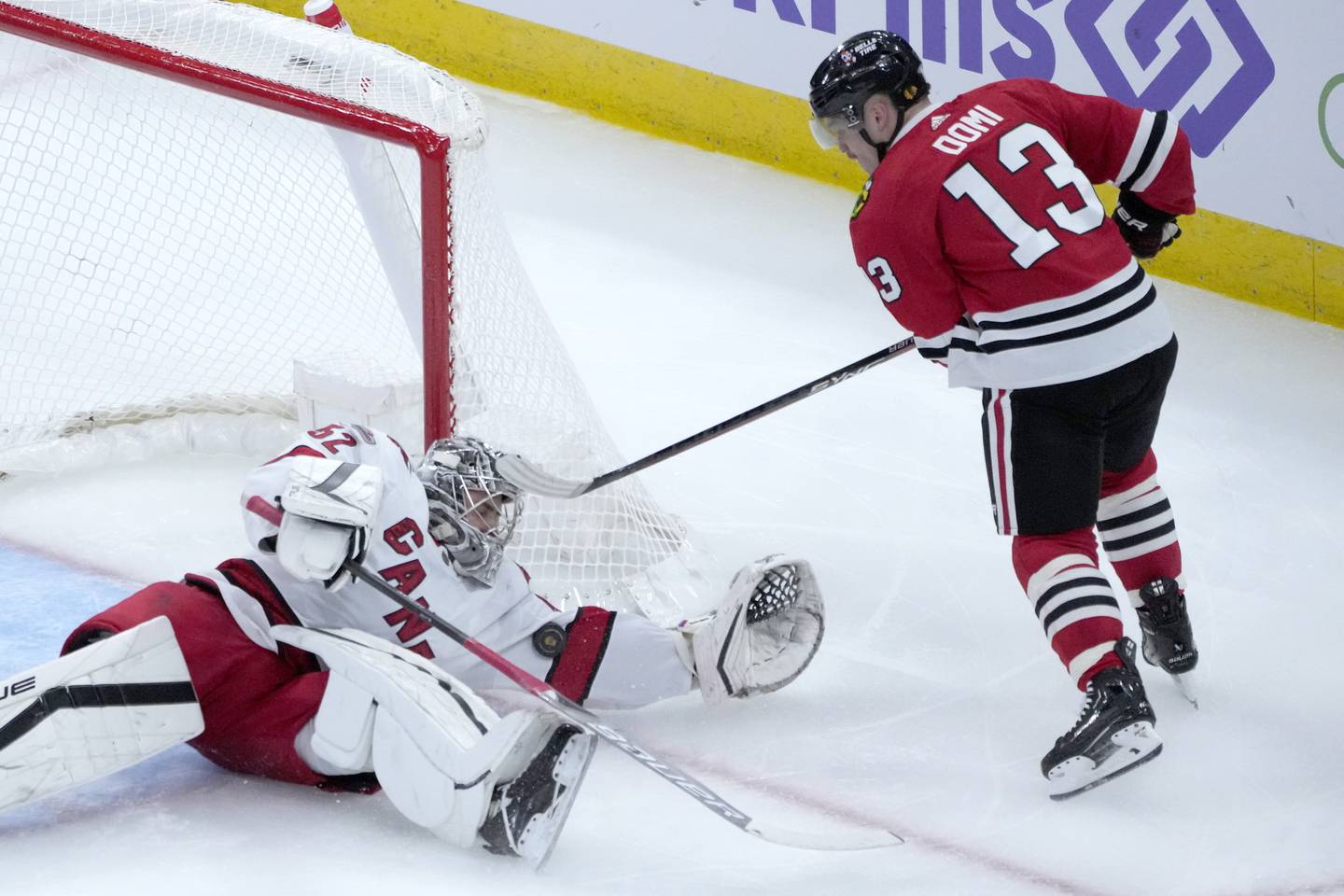 Hurricanes goaltender Pyotr Kochetkov makes an arm-save on a shot by the Blackhawks' Max Domi during the second period on Nov. 14, 2022.