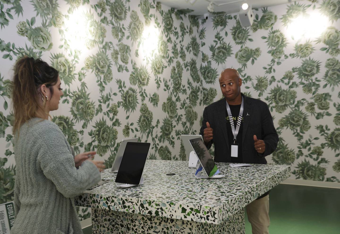 Todd Patterson, right, and Candice Sagala help set up at the soon-to-open Green Rose Dispensary on Nov. 10, 2022, in Chicago.