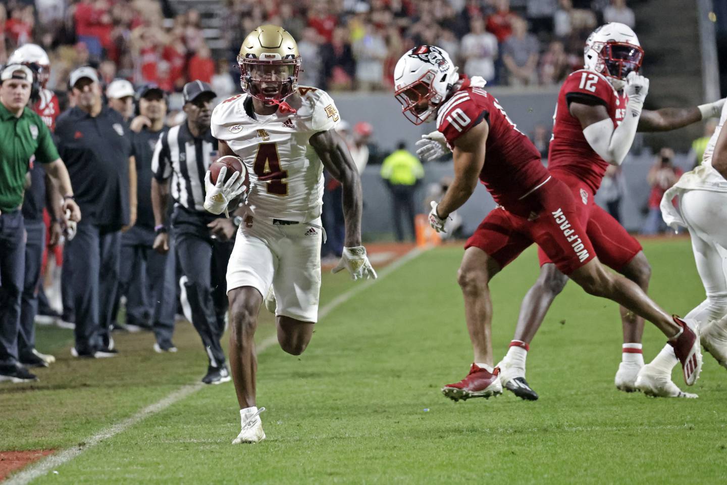 Boston College wide receiver Zay Flowers gets past North Carolina State safety Tanner Ingle en route to a touchdown reception Saturday in Raleigh, N.C. 