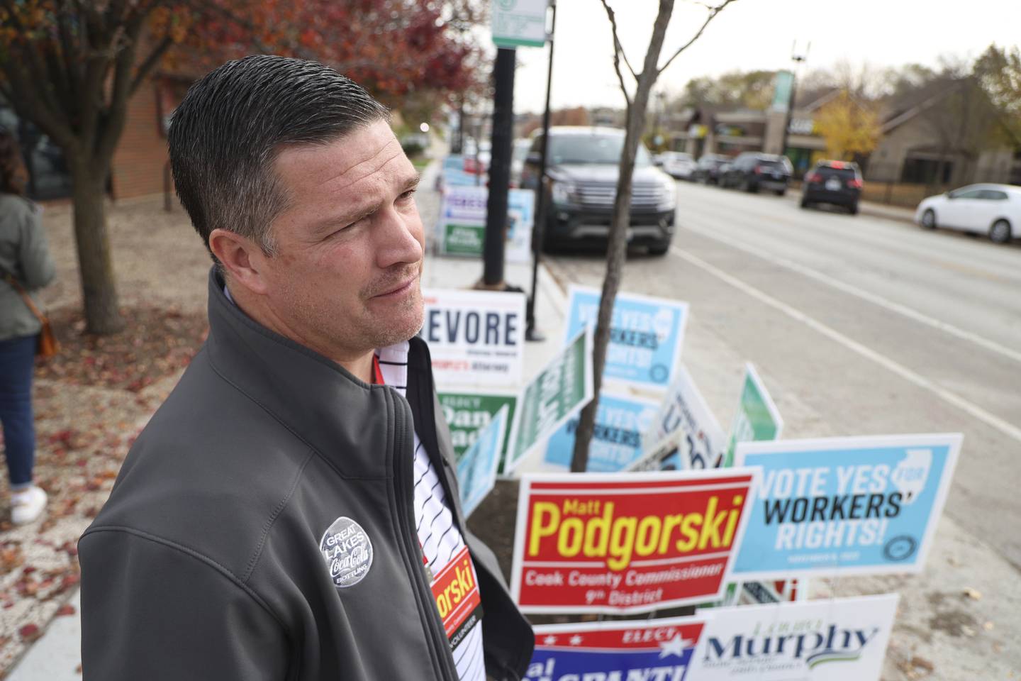 Republican Cook County Board 9th District candidate Mike Podgorski hands out flyers outside of Roden Library on Oct. 30, 2022, in Chicago. 