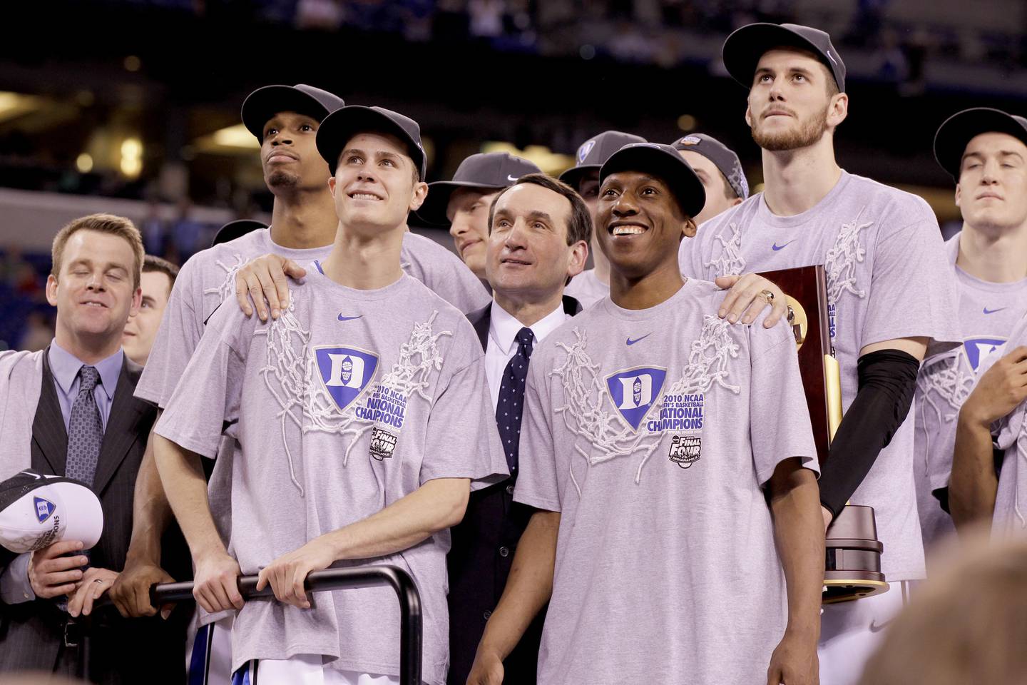 Duke coach Mike Krzyzewski with his arms on the shoulders of Jon Scheyer, left, and Nolan Smith as they watch "One Shining Moment" during the postgame ceremony after defeating Butler in the NCAA championship game on April 5, 2010, at Lucas Oil Stadiuim in Indianapolis.