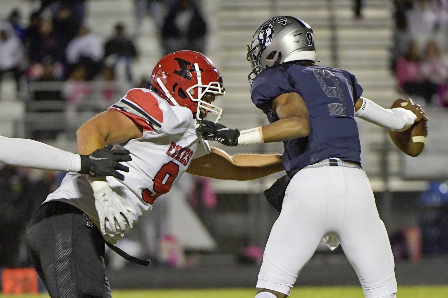 Yorkville defensive end Andrew Laurich (9) sacks Oswego East quarterback Tre Jones during a Southwest Prairie West game on Friday, Oct. 7, 2022.