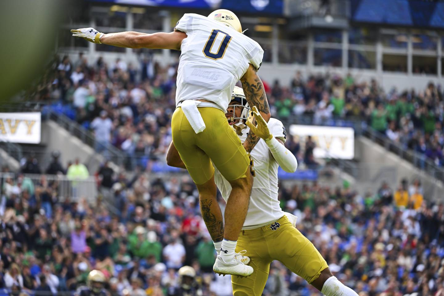 Notre Dame wide receiver Braden Lenzy (0) celebrates his touchdown catch with Lorenzo Styles Saturday in Baltimore. 