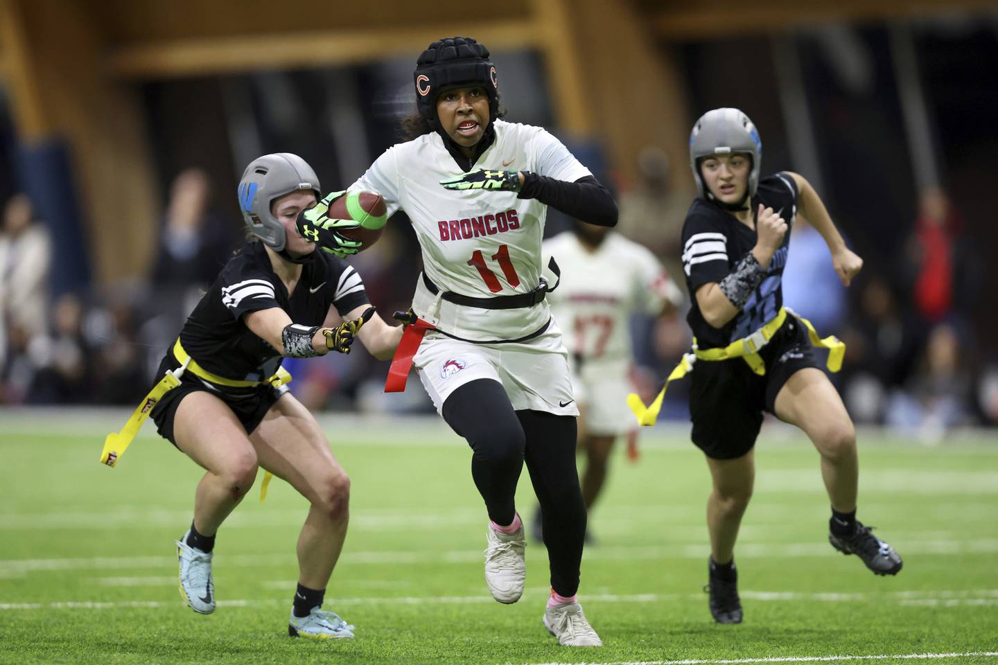 Kenwood Academy’s Gabrielle Speller tries to break free from two Willowbrook High School defenders during their semifinal game.