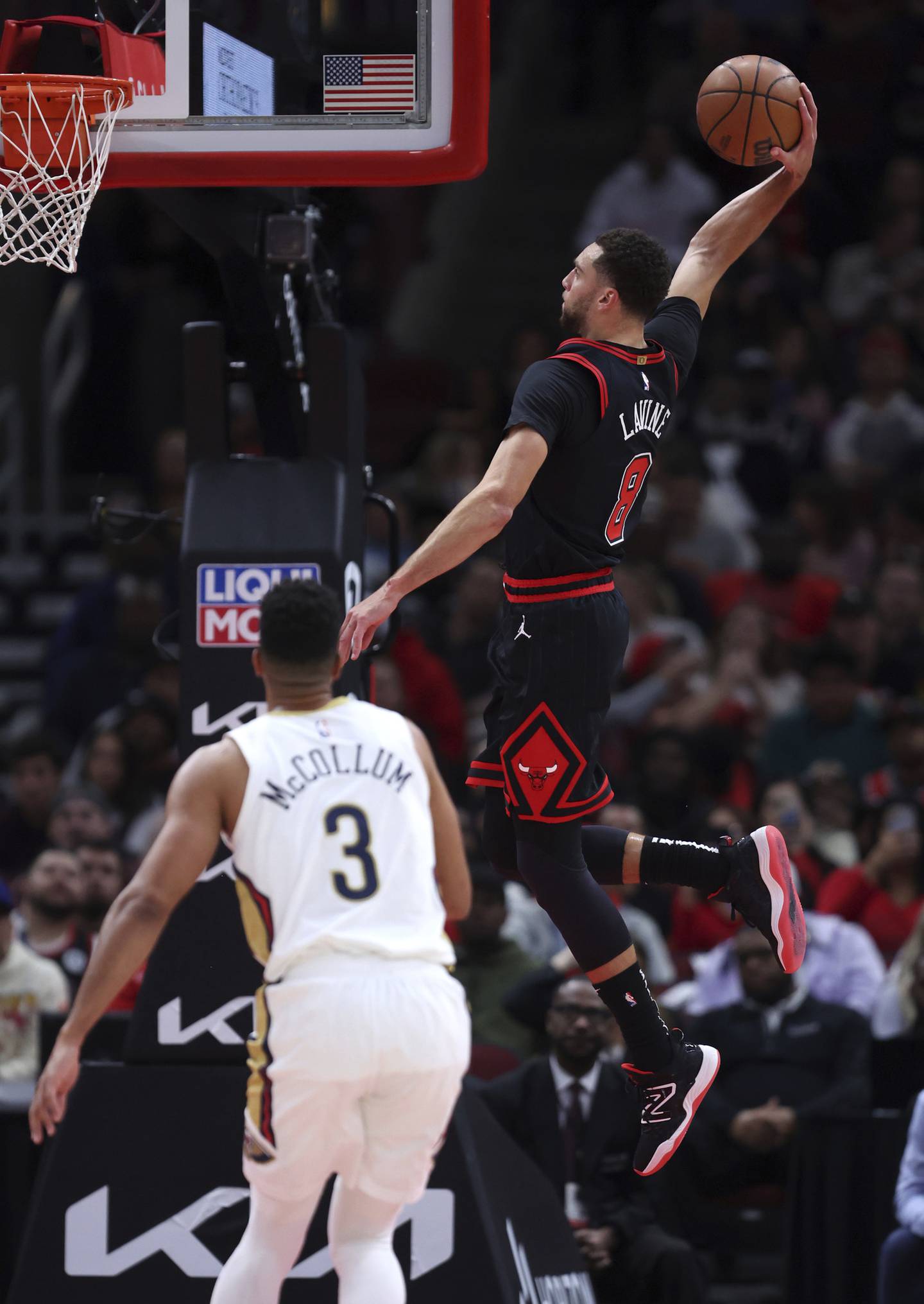 Bulls guard Zach LaVine (8) flies in for a dunk in the first half against the Pelicans on Wednesday at the United Center. 