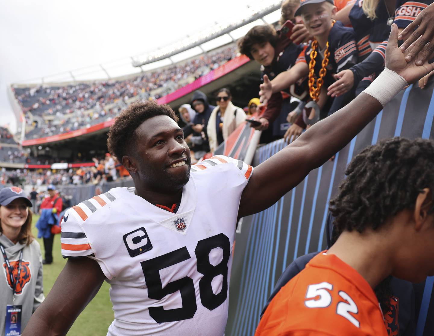 Chicago Bears linebacker Roquan Smith (58) celebrates with fans after a victory over the Houston Texans at Soldier Field, Sept. 25, 2022.
