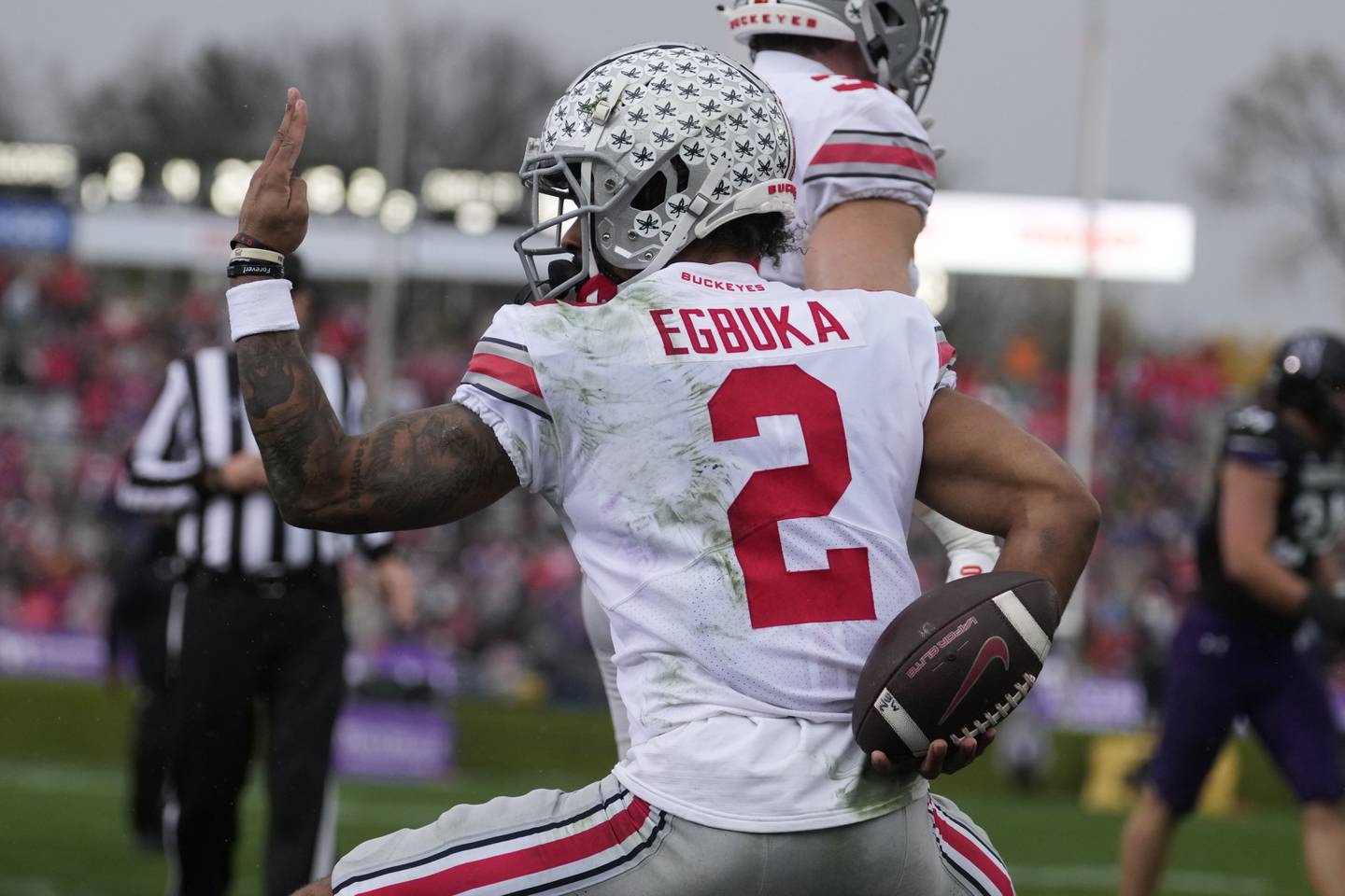 Ohio State wide receiver Emeka Egbuka celebrates after scoring a touchdown against Northwestern during the first half Saturday in Evanston. 