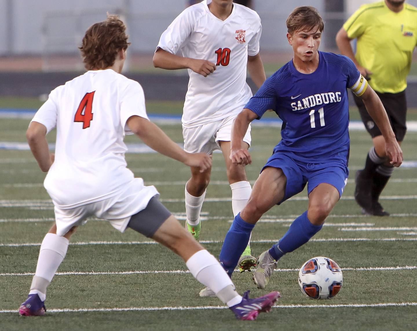 Sandburg's Sebastian Burzynski (11) works the ball down the field as Shepard's Ryan Plowman defends during a nonconference game in Orland Park Sept. 7, 2022.