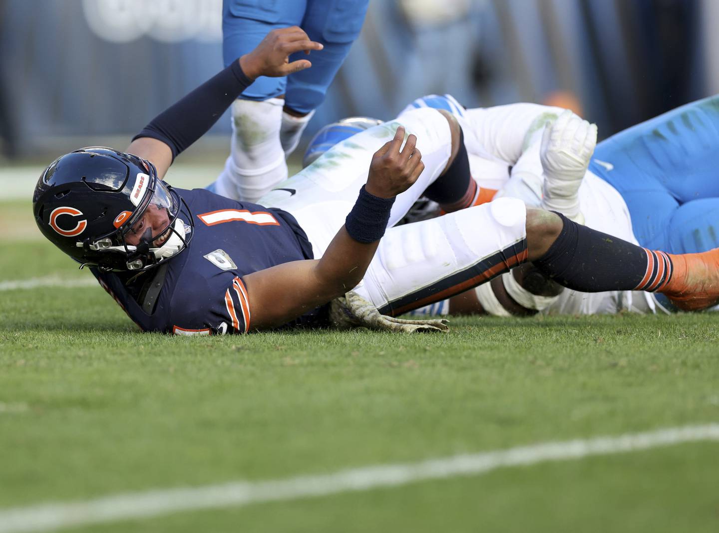 Bears quarterback Justin Fields (1) watches a pass that was intercepted and returned for a touchdown by Lions cornerback Jeff Okudah in the fourth quarter Sunday, Nov. 13, 2022, at Soldier Field.