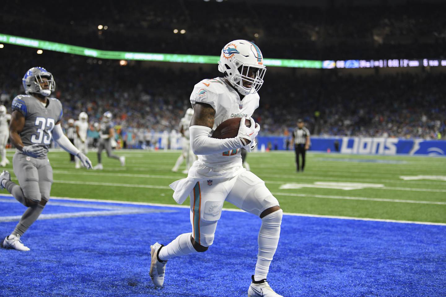 Miami Dolphins wide receiver Jaylen Waddle catches a 5-yard pass for a touchdown during the first half against the Detroit Lions, Oct. 30, 2022, in Detroit.
