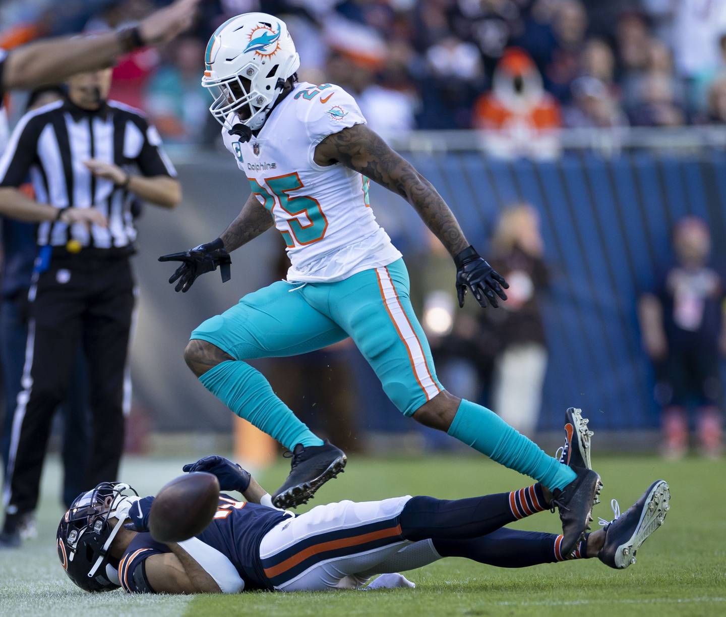 Bears wide receiver Equanimeous St. Brown can’t catch the final pass of the game as Dolphins cornerback Xavien Howard defends  Sunday at Soldier Field. The Dolphins won 35-32. 