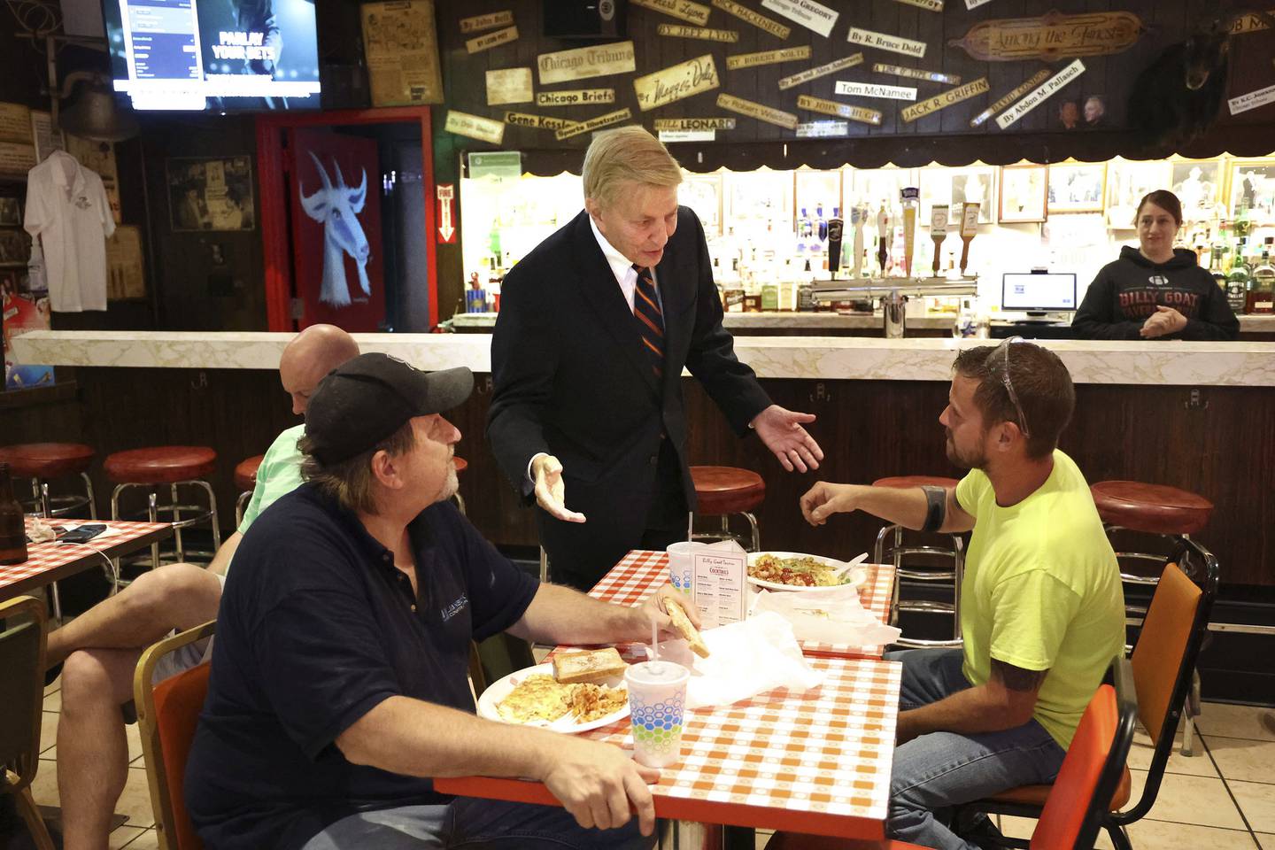 Bob Fioretti, former 2nd Ward alderman and attorney, announces his candidacy for Cook County Board president as he greets diners at the Billy Goat Tavern.