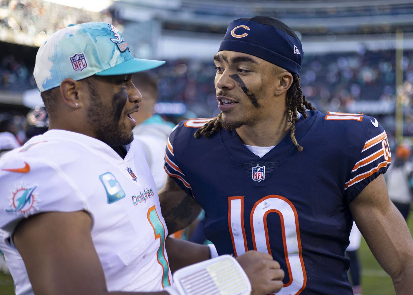 Dolphins quarterback Tua Tagovailoa (1) and Bears wide receiver Chase Claypool (10) talk after the game Sunday, Nov. 6, 2022, at Soldier Field.