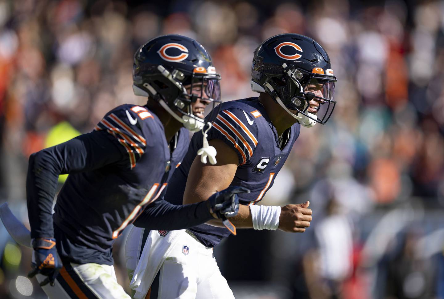 Chicago Bears quarterback Justin Fields (1) celebrates his touchdown pass to wide receiver Darnell Mooney (11) in the second quarter, Nov. 6, 2022, at Soldier Field.