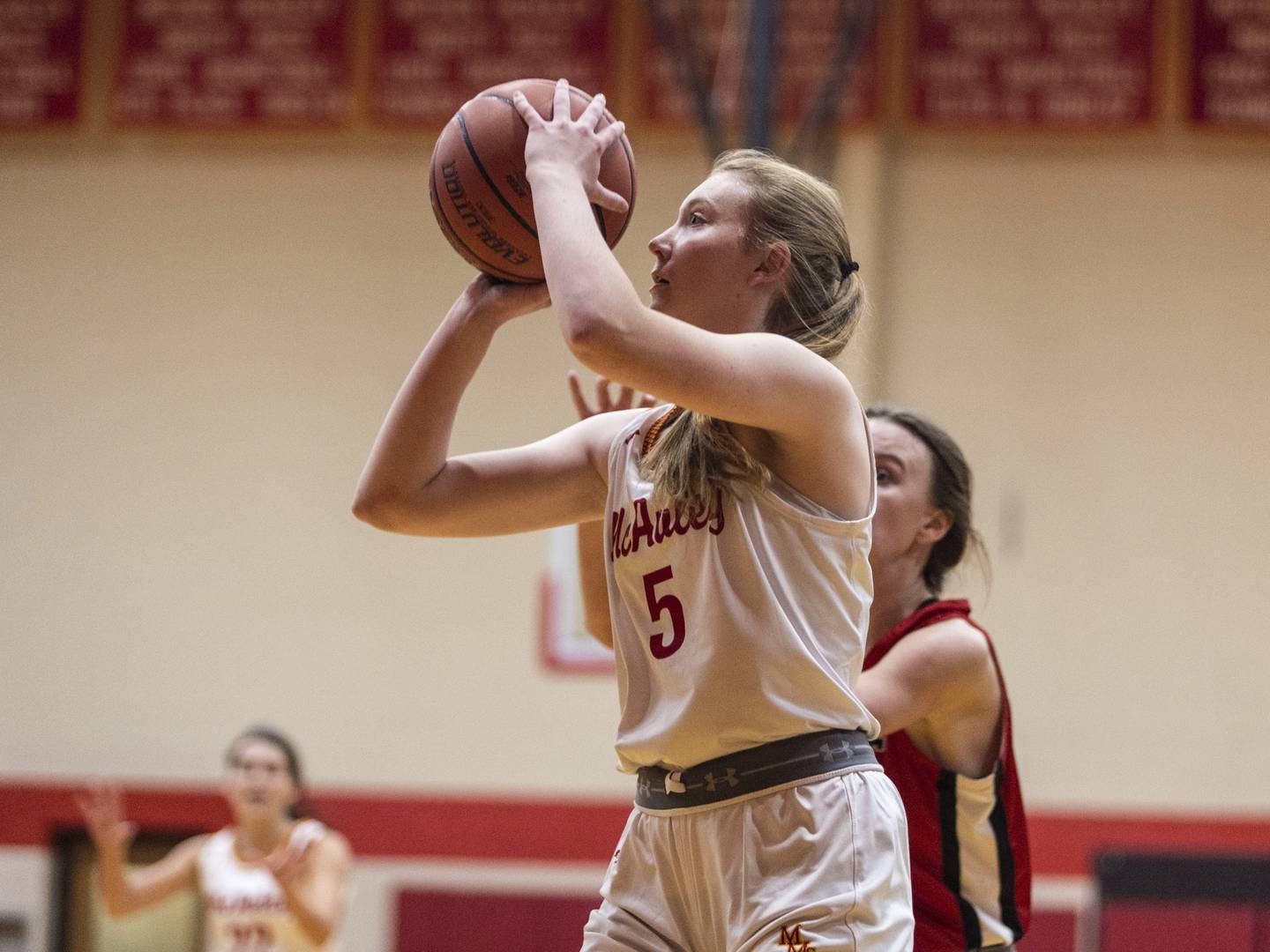 Mother McAuley's Morgan Feil (5) puts up a 3-pointer against Marist during a nonconference game in Chicago on Thursday, Dec. 8, 2022.