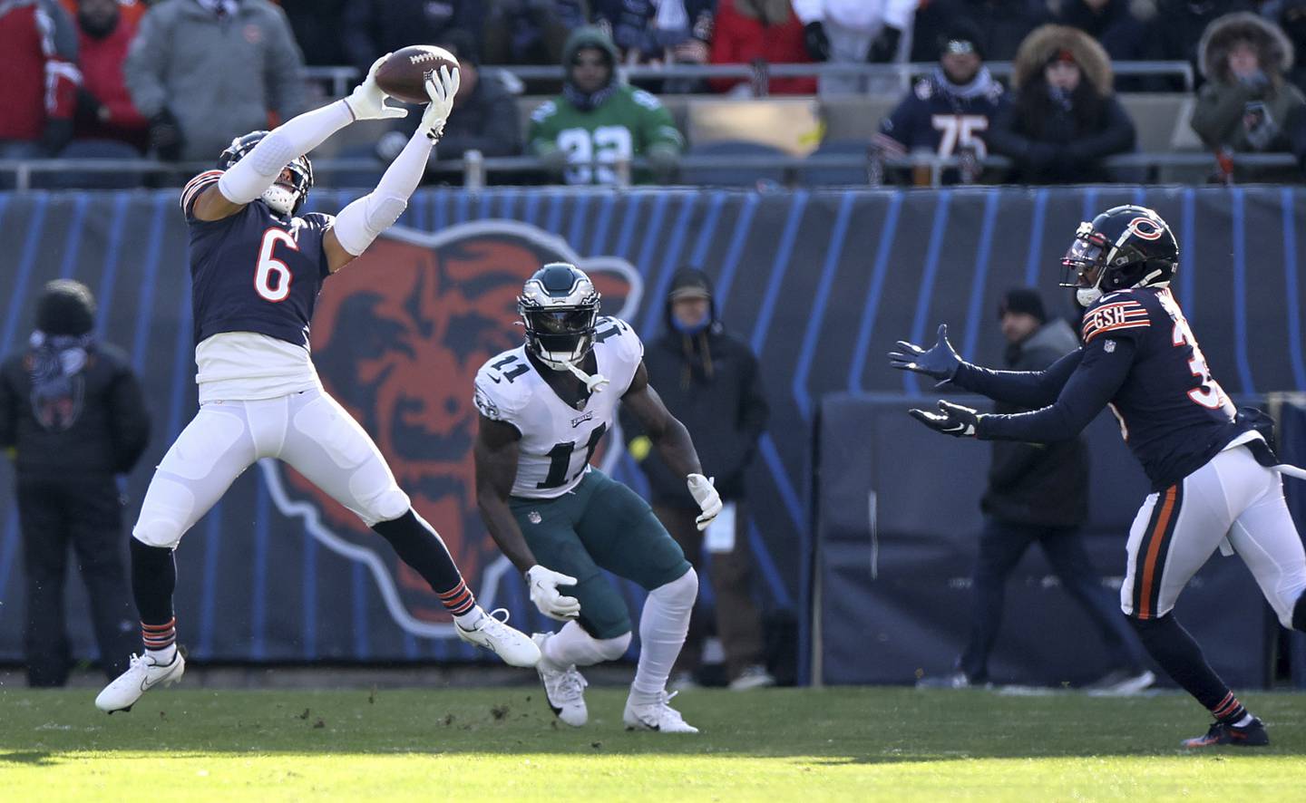Bears cornerback Kyler Gordon intercepts the ball in the first quarter of a game against the Eagles at Soldier Field on Dec. 18, 2022.